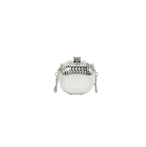Close-up of silver vertical wavy texture on a mini metallic hardshell evening clutch bag