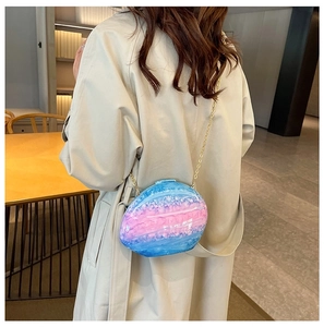 Chic blue and pink gradient shell-shaped acrylic clutch bag with a golden chain strap