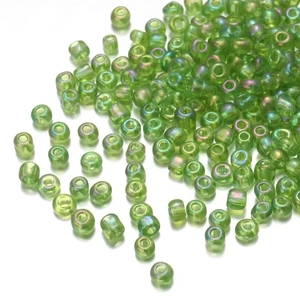 Green iridescent glass seed beads 2-3mm for jewelry making on white background