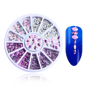 Detail of pink and silver nail art rhinestones with storage disk and sample application