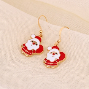Detailed view of handmade Santa Claus earrings with red enamel and golden alloy hooks