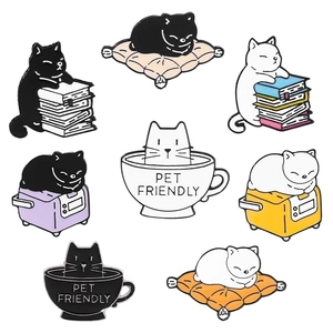 Set of 8 cute cartoon enamel cat pins including black and white cats in teacups and on books