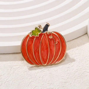 Exquisite orange pumpkin brooch with green leaf and gold trim for festive clothing accessories