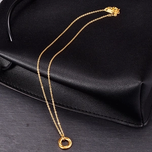 Elegant 18K gold minimalist interlocking double ring necklace with adjustable chain