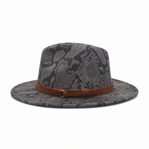 Detail of grey snakeskin fedora hat with brown leather band and gold buckle