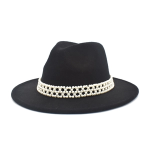 Detailed view of the fedora crown featuring multi-layer white pearl mesh decorative band