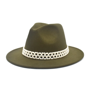 Detail of dark olive wool fedora hat featuring a honeycomb white pearl decorative band