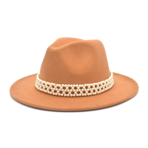 Detailed texture of caramel wool felt fedora featuring triple row pearl beaded band decoration
