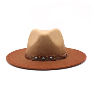 Detail of wool fedora hat with turquoise beads and rivets on braided leather band
