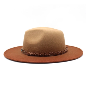 Detail of wool felt fedora with woven leather band, metal studs and blue bead accents