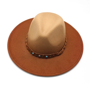 Detailed shot of fedora hat with turquoise studs and woven leather decorative band