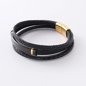 Multi-layer black braided leather bracelet for men featuring a gold magnetic clasp