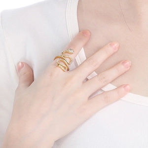 Elegant gold snake wrap ring with crystal pavé setting for a luxury fashion statement