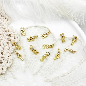DIY 18k gold plated micro-inset zircon alphabet pendants on white lace background