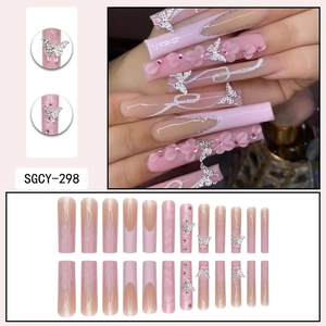 Pink gradient coffin press-on nails with silver butterflies and glitter accents