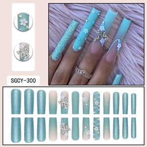 Long square press-on nails with 3D flowers, blue bow rhinestones and glitter finish