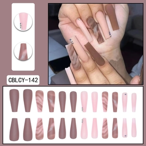 Long coffin marble press-on nails in pink and brown with rhinestone accents