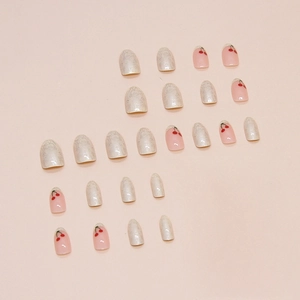 French almond press-on nails set with red cherry patterns and pearl lace designs
