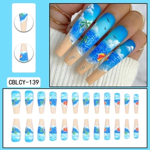 Hawaiian beach press-on nails with blue ocean palm tree designs in long ballet shape