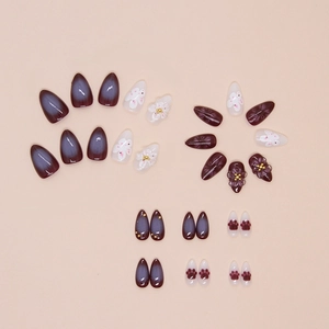Almond-shaped press-on nails with 3D white flowers, cat paw prints and purple gradient