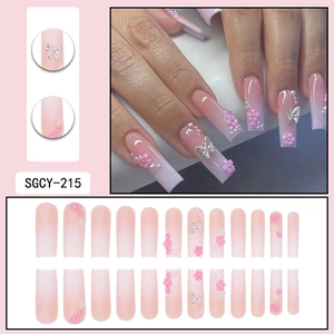 Pink ombre press-on nails set with 3D flowers, silver butterflies, and pearls detail