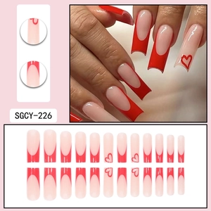 Press-on nail set featuring 24 red heart French tip designs in various sizes