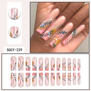 French style pink press-on nails with botanical leaf patterns and fine artistic lines
