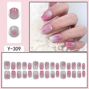 Pink cat-eye press-on nails with glitter firework patterns in a short square shape
