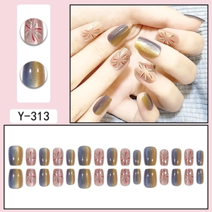 Short square press-on nails with blue cat eye texture and colorful firework patterns