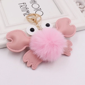 Cute pink plush crab keychain with fuzzy fur ball and golden ring for bags