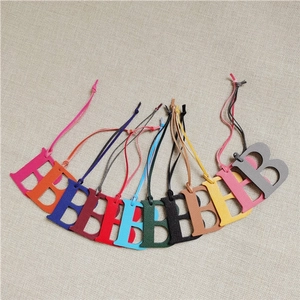 Litchi pattern leather letter B bag charms in eleven vibrant colors with matching loops