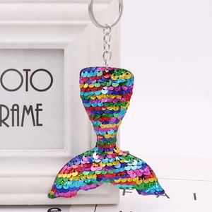 Close-up of vibrant rainbow sequins on a mermaid tail keychain with a metal ring