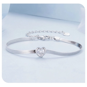 Macro detail of S925 sterling silver stamp on shimmering heart zircon bracelet