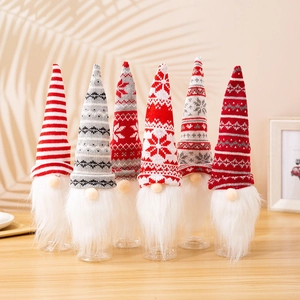 Detail showing 6 Christmas gnome wine bottle covers with knitted hats and faux fur beards