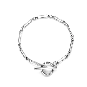 Detail of silver stainless steel link bracelet featuring a classic OT T-bar clasp closure