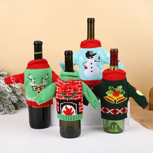 Knitted Christmas wine bottle covers with reindeer and snowman festive patterns