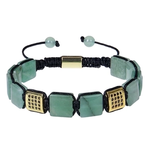 Macro shot of 10mm square malachite stone charm on adjustable black braided rope bracelet