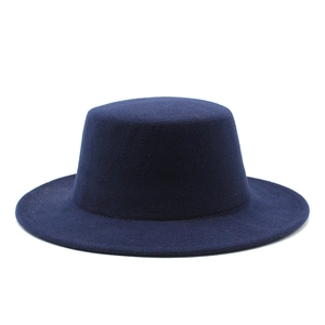 Detailed view of navy blue flat top wool felt hat texture and wide brim structure