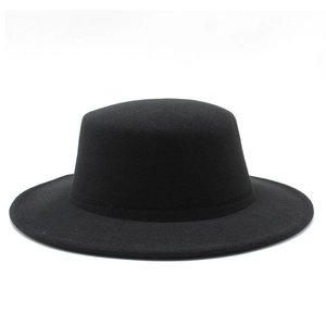 Detailed texture of black wool felt boater hat with flat brim for autumn and winter