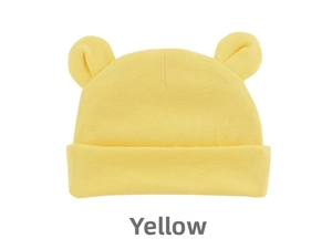 Detailed close-up of yellow knit baby beanie with cute 3D round ears and soft cotton texture