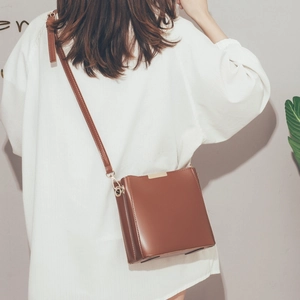 Classic dark brown vintage bucket bag in glossy PU leather with adjustable strap