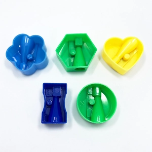 Mini colorful plastic pencil sharpeners in various shapes like heart and flower