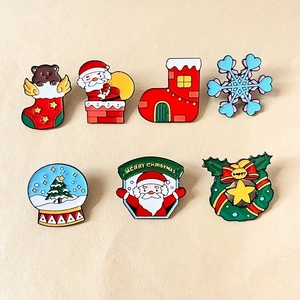 Colorful Christmas enamel lapel pins set with Santa, snowflake, and bear on metal badges