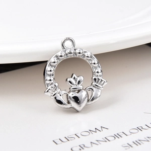 Detailed view of silver Claddagh heart charm pendant with crown for jewelry making