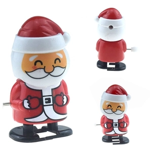 Detailed multi-angle view of a wind-up Santa Claus toy with a classic red and white design