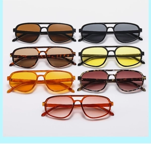 Detailed grid of double-bridge aviator sunglasses in various colors and tinted lenses
