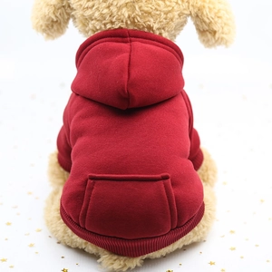 Detail of red pet hoodie featuring a functional back pocket and soft fleece texture