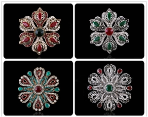 Baroque retro brooches with intricate hollow designs and inlaid colorful gemstones
