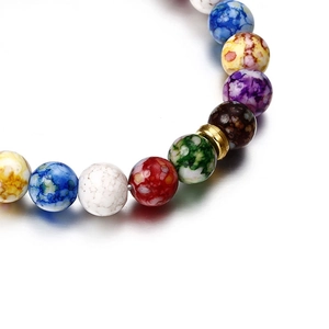 Lava stone chakra bead bracelet with colorful natural stones and a gold metal spacer bead