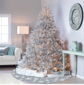 Detail of 122cm grey Christmas tree skirt with white snowflakes under a decorated tree